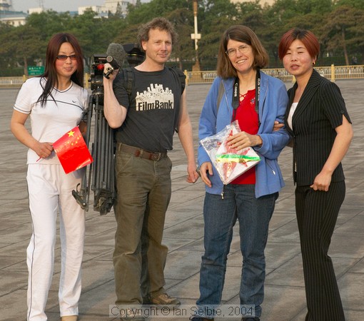 Local tourists posing with foreigners, Tiannanmen Square, Beijing