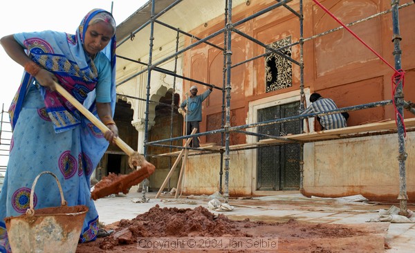 Female construction worker renovating at Diwan-i-Khas at the Red Fort, Delhi