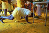 Some of the devotees prostrate themselves before the godess