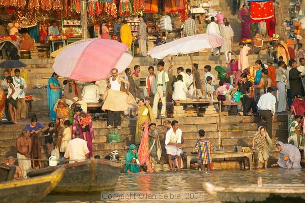 The Ganges river, Varanasi - soon after sunrise and the Bathing Ghats are altready teeming
