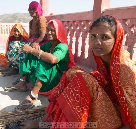 Street sweeper women, having a rest and a smoke, Jaipur