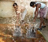 Men washing a new carpet, Jaipur
