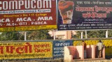 Roadside urinal, with advertising hoardings above, Jaipur