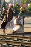 Two holy men walking along the railway tracks, Jaipur