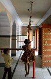 Child jumping to ring the bell at the Ganesha temple, Jaipur