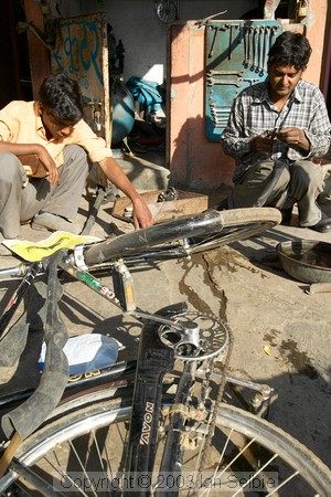Road side bicycle repair man and his latest job, Jaipur