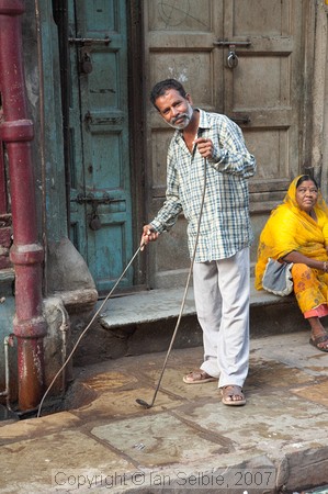 Demonstrating how to clean out the drain