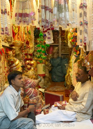 Two men in a small shop, Old Delhi
