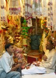 Two men in a small shop, Old Delhi