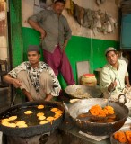 Preparing food just before break-fast in the street market near the Tomb of Nizammudin, Delhi