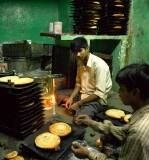 Preparing food just before the break-fast at the street market near the Tomb of Nizammudin, Delhi