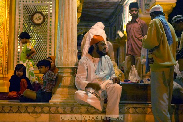 Worshippers and officials after evening prayers  at the Tomb of Nizammudin, Delhi