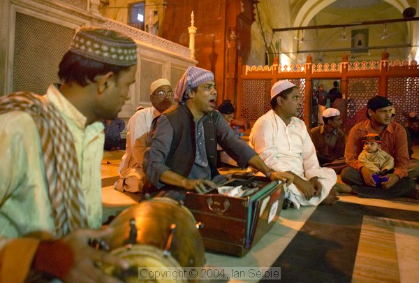Musicians playing after evening prayers  at the Tomb of Nizammudin, Delhi