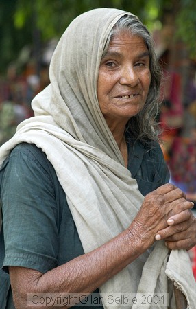 Beggar at the Janpath Lane textiles market
