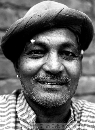 The ear cleaning man at the Janpath Lane textiles market, Delhi.