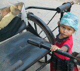 Nizammudin district, Delhi.  One of the oldest districts, largely muslim and also home to a community of migrants from Assam who make a living out of collecting and recycling the city's garbage.  This child was playing nearby.