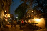 Nizammudin district, Delhi.  Almost dark and the night vendors are already about.