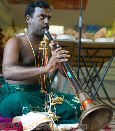 Horn player at celebration of the birthday of Lord Ganesha at Sri Senpaga Vinayagar Temple, Ceylon Road, Singapore