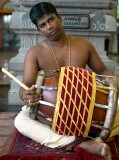 Drum player at celebration of the birthday of Lord Ganesha at Sri Senpaga Vinayagar Temple, Ceylon Road, Singapore