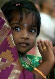 Child praying on the birthday of Lord Ganesha at Sri Senpaga Vinayagar Temple, Ceylon Road, Singapore