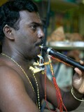 Horn player at celebration of the birthday of Lord Ganesha at Sri Senpaga Vinayagar Temple, Ceylon Road, Singapore