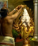 Pouring milk over the statue of Lord Ganesha on his birthday at Sri Senpaga Vinayagar Temple, Ceylon Road, Singapore