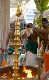 Preparing to douse the flames on the birthday of Lord Ganesha at Sri Senpaga Vinayagar Temple, Ceylon Road, Singapore