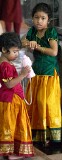 Brightly dressed little girls at celebration of the Depavali Festival at Sri Senpaga Vinayagar Temple, Ceylon Road, Singapore