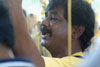 Thaipusam - Loud chanting distracts the kavadi bearer from the pain of the spike