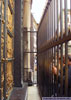Tourists peering through the bars at the golden east doors of the Baptistry of the Duomo