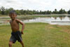 Boy running from his bath at Sra Srang (the 'Royal Bath')