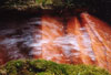 Water channel at Chalice Well, Glastonbury. Red due to iron oxide in the water