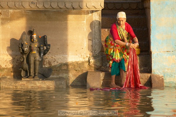 There are thousands of large and small shrines and lingas in Varanasi - at, above and below the present water level.   Everyday life goes on as they watch