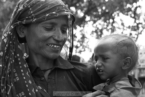 Beggar woman and sick child, Varanasi