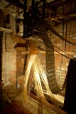 Silk weaver works in a room just big enough to hold the loom, Varanasi