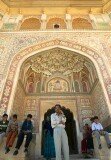 Man and his family under archway, Amber Palace, Jaipur