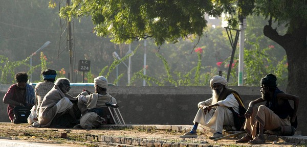 Holy men waiting beside the tracks at Jaipur railway station