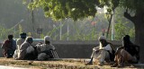 Holy men waiting beside the tracks at Jaipur railway station