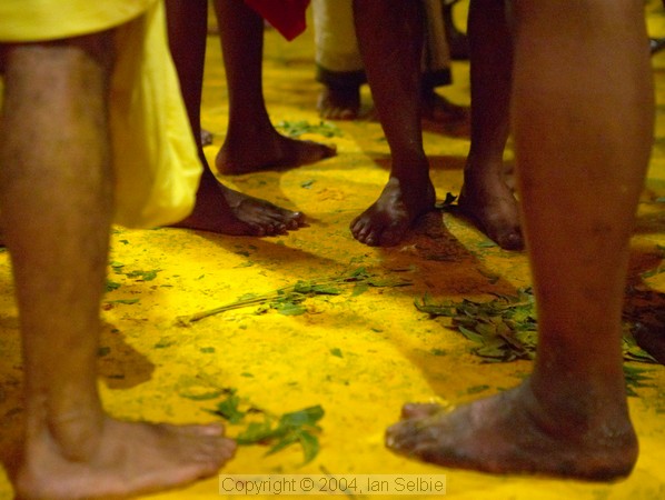 Yellow Tumeric powder everywhere on the floor at the Thimithi (fire walking) ceremony, Singapore 2003