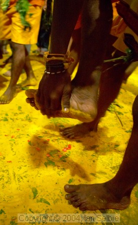 Yellow Tumeric powder everywhere on the floor at the Thimithi (fire walking) ceremony, Singapore 2003