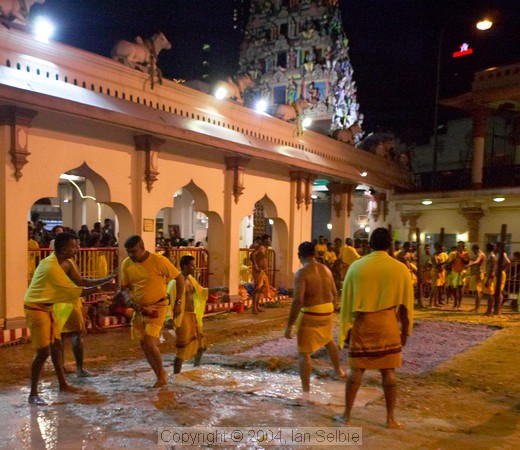 Walking the coals before dawn at the Thimithi (fire walking) ceremony, Singapore 2003