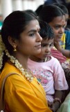 Mother and child watching the Thimithi (fire walking) ceremony, Singapore 2003