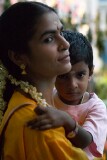 Mother and child watching the Thimithi (fire walking) ceremony, Singapore 2003