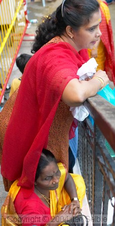 Tired spectators at the Thimithi (fire walking) ceremony, Singapore 2003